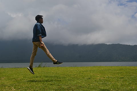 elevating, jump, people, elevation, cloud - sky, full length, leisure activity, one person, grass, sky, casual clothing, men, nature, real people, side view, water, plant, sport, lifestyles, day, young adult, standing, outdoors, 4K, CC0, public domain, royalty free