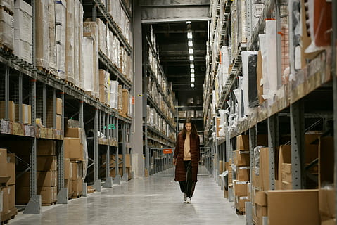 woman, walking, hallway, wearing, corridor, architecture, building, one person, warehouse, domestic room, indoors, shipping, freight transportation, distribution warehouse, business, box, container, industry, full length, shelf, stack, working, transportation, abundance, large group of objects, box - container, aisle, 2K, CC0, public domain, royalty free