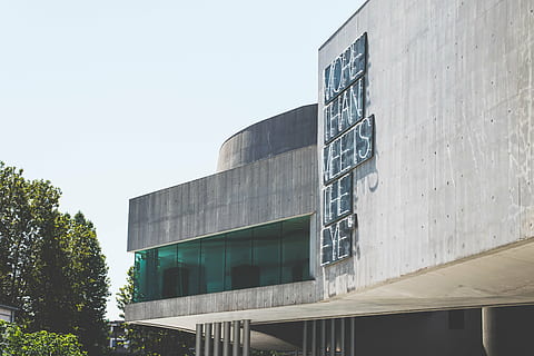 gray, concrete, building, trees, architecture, infrastructure, structure, establishment, text, quotes, day, outdoors, modern, building exterior, built structure, no people, close-up, sky, nature, low angle view, clear sky, glass - material, office, tree, plant, city, window, office building exterior, sunlight, 5K, CC0, public domain, royalty free