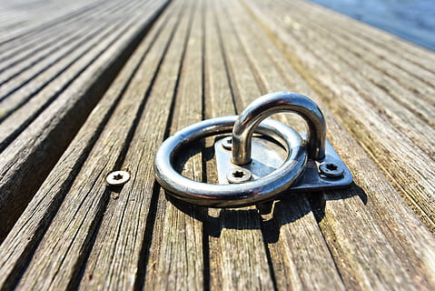 untitled, mooring ring, ring, secure, tie, moor, boat, ship, marina, nautical, marine, maritime, water, jetty, wharf, outdoors, wood - material, metal, close-up, no people, plank, sunlight, day, wood, shadow, nature, connection, textured, high angle view, jewelry, shape, selective focus, safety, circle, focus on foreground, silver colored, wood grain, 5K, CC0, public domain, royalty free
