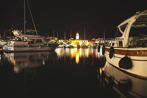 boats, harbor, harbour, night, pier, port, reflection, sea, water, watercrafts, yachts, transportation, nautical vessel, mode of transportation, moored, illuminated, waterfront, no people, mast, sailboat, nature, yacht, pole, sky, ship, anchored, marina, luxury, 5K