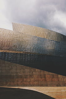 brown, black, concrete, brick wall, architecture, building, infrastructure, cloud, sky, built Structure, building Exterior, low angle view, cloud - sky, no people, city, nature, day, modern, reflection, outdoors, pattern, office, tall - high, tower, office building exterior, sunlight, skyscraper, 2K, CC0, public domain, royalty free