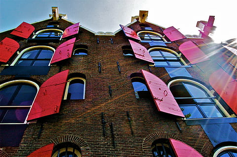 concrete, building, red, opened, windows, low, angle, view, high, rise, buildin, shutters, bricks, wall, sun rays, building exterior, arch, no people, architecture, history, day, low angle view, outdoors, sky, built structure, window, residential district, nature, the past, multi colored, roof, brick, old, brick wall, 1080P, CC0, public domain, royalty free