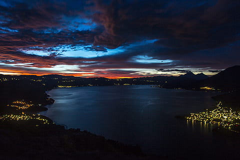 calm, body, water, mountain, night time, landscape photography, lighted, islands, photo, city lights, body of water, lake, sky, cloud, light, nature, scenics, sunset, landscape, dusk, night, reflection, outdoors, cloud - Sky, beauty In Nature, summer, sea, blue, scenics - nature, tranquility, tranquil scene, no people, dramatic sky, illuminated, city, environment, cityscape, 5K, CC0, public domain, royalty free