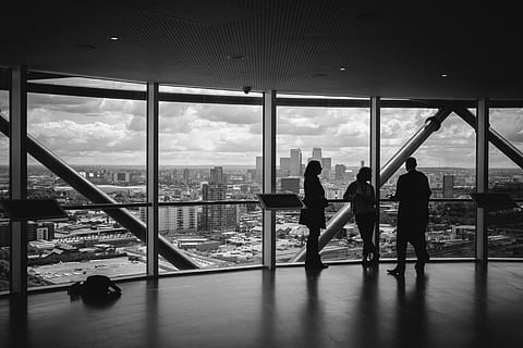three, silhouette person, standing, window, observation deck, skyscraper, viewing platform, viewpoint, cityscape, architecture, city, skyline, view, urban, modern, panorama, black and white, people, windows, buildings, talking, lookout, glass - material, transparent, indoors, built structure, sky, water, nature, men, group of people, real people, cloud - sky, women, day, adult, flooring, office building exterior, 5K, CC0, public domain, royalty free