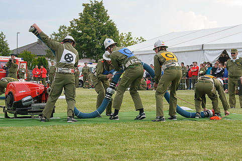 fire, competition, competitions, fire fighting attack, firefighter competition, sport, people, group of people, full length, men, real people, day, plant, crowd, nature, clothing, males, grass, green color, outdoors, standing, adult, group, 4K, CC0, public domain, royalty free