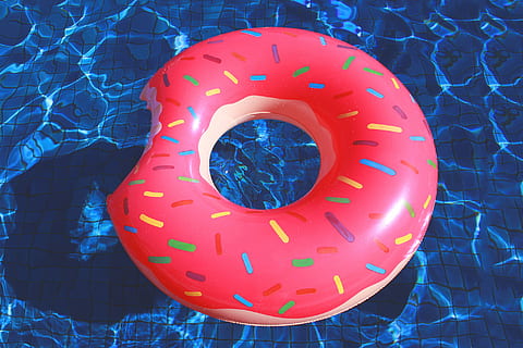 bitten, donut inflatable floater, donut, inflatable, floater, blue, food, snack, red, no people, close-up, day, outdoors, circle, geometric shape, shape, directly above, orange color, pattern, design, high angle view, art and craft, floral pattern, plastic, indoors, food and drink, 1080P, CC0, public domain, royalty free