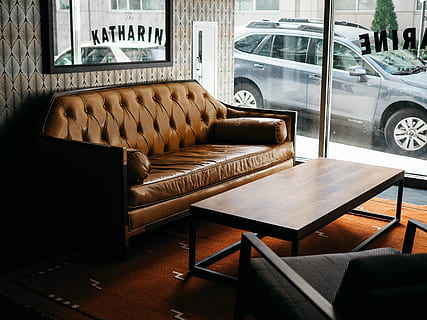 gray, suv, parked, outside, building, brown, leather sofa, clear, glass wall, sofa, couch, leather, window, seat, indoors, car, furniture, no people, motor vehicle, mode of transportation, chair, transportation, table, wood - material, architecture, land vehicle, pillow, absence, built structure, day, coffee table, domestic room, luxury, 4K, CC0, public domain, royalty free