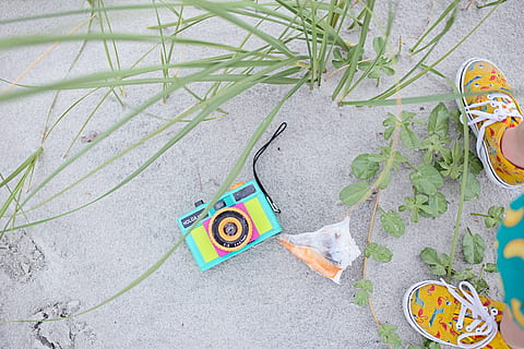 multicolored, digital, camera, pair, brown, shoes, beach, bright, child, color, decoration, design, footwear, from above, kid, leaves, sand, shell, shore, summer, technology, tropical, vacation, high angle view, plant, no people, day, nature, outdoors, creativity, footpath, green color, art and craft, leaf, city, plant part, street, grass, representation, still life, growth, directly above, equipment, 5K, CC0, public domain, royalty free