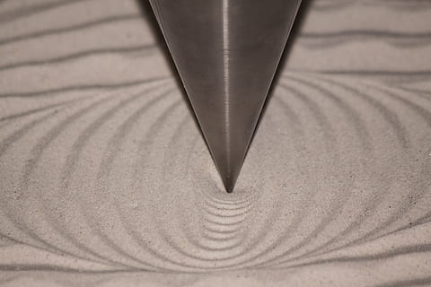 foucault pendulum, pendulum, Foucault Pendulum, pendulum, pendulum frequency, vibration frequency, pendulum vibrations, sand, pattern, trace, no people, close-up, indoors, concentric, day, paper, metal, furniture, textile, black color, backgrounds, sharp, writing instrument, creativity, single object, leather, shadow, extreme close-up, textured, table, art and craft, steel, 4K, CC0, public domain, royalty free