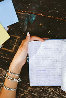 diary, table, Woman reading, woman, book, notebook, hands, reading, memories, journal, memoirs, human Hand, people, paper, letter, religion, one person, adult, adults only, one woman only, high angle view, human body part, hand, real people, holding, women, lifestyles, publication, personal perspective, communication, unrecognizable person, leisure activity, human finger, indoors, finger, nail, 4K