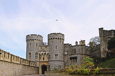 architecture, building, castle, clouds, daylight, landmark, landscape, medieval, old, outdoors, stone, stone wall, wall, built structure, building exterior, sky, history, the past, nature, day, low angle view, no people, travel destinations, cloud - sky, plant, tree, fort, city, 5K
