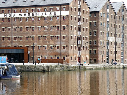 warehouse, quay, river, water, architecture, built structure, waterfront, building exterior, building, day, incidental people, city, canal, mode of transportation, transportation, window, nature, outdoors, real people, reflection, residential district, sunlight, 1080P, CC0, public domain, royalty free