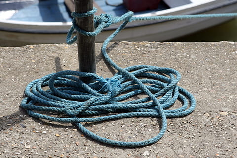 Aquatic, Boat, Braid, Cable, braided, cord, fasten, knot, lead, line, marine, moor, mooring, nautical, naval, oceanic, quay, quayside, rope, sail, sailing, sea, seafaring, secure, tidal, tie, tied, tighten, twine, twisted, no people, blue, close-up, day, nautical vessel, indoors, tied up, strength, metal, connection, focus on foreground, moored, post, high angle view, outdoors, still life, bollard, textured, pattern, rusty, transportation, tangled, 2K, CC0, public domain, royalty free