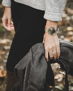 person, wearing, gray, knit, sweater, holding, black, leather jacket, fashion, fashionable, hands, jewelry, outdoors, ring, style, watch, wear, woman, women fashion, human hand, real people, hand, human body part, one person, midsection, women, adult, focus on foreground, time, lifestyles, leisure activity, bracelet, wristwatch, day, body part, jeans, 4K