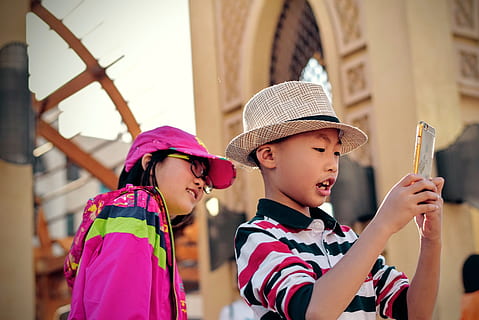 portrait, cute, girl, arched window, Asian, boy, cap, child, children, city, communication, contact, enjoyment, family, festival, friends, fun, happy, hat, kid, leisure, little, love, outdoors, people, smartphone, street, togetherness, traditional, travel, wear, young, childhood, offspring, males, men, boys, clothing, females, looking, women, two people, casual clothing, emotion, focus on foreground, girls, innocence, 2K