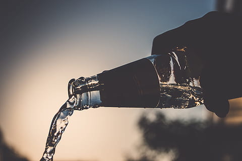 person, pours, water bottle, water, inside, glass bottle, spilling, daytime, waterflow, bottle, flow, pour, outdoors, human Hand, clear sky, sunset, illuminated, adult, adults only, one person, holding, nature, human body part, drink, pouring, technology, food and drink, men, sunlight, refreshment, hand, lens flare, drinking, 5K, CC0, public domain, royalty free
