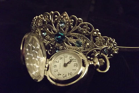 round silver-colored analog pocket, watch, tiara, clock, time, accessory, crown, elegance, luxury, princess, studio shot, indoors, close-up, jewelry, no people, black background, single object, metal, pocket watch, still life, antique, wealth, silver colored, shiny, instrument of time, 2K, CC0, public domain, royalty free