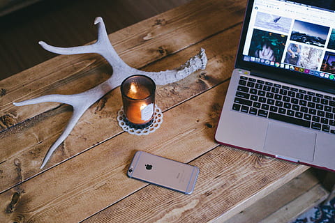 apple, candle, computer, desk, display, iphone, laptop, mobile phone, smartphone, table, wooden, technology, wireless technology, connection, communication, wood - material, portable information device, indoors, no people, place of work, business, high angle view, smart phone, computer equipment, office, business finance and industry, equipment, using laptop, keyboard, 5K, CC0, public domain, royalty free