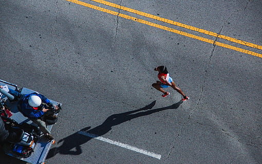 woman, running, gray, asphalt, photo, red, tops, road, people, fitness, race, marathon, sunny, day, street, high angle view, real people, outdoors, two people, lifestyles, full length, adult, transportation, city, sign, road marking, symbol, marking, sport, men, shadow, dividing line, 5K, CC0, public domain, royalty free