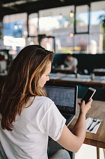 young, woman, working, cafe, caucasian, female, office, workspace, workplace, computer, macbook, technology, coffee, laptop, restaurant, indoors, businesswoman, women, people, females, adult, internet, lifestyles, young Adult, casual Clothing, one Person, wireless Technology, communication, smiling, caucasian Ethnicity, mobile Phone, sitting, coffee Shop, young Women, text Messaging, e-Mail, smart Phone, holding, looking, adults Only, copy Space, happiness, cheerful, only women, one woman only, focus on foreground, real people, screen, connection, mid adult, touch screen, leisure activity, hairstyle, 4K
