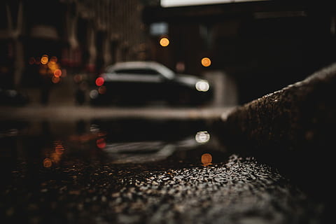 worm, eye view photography, concrete, gutter, water, car, puddle, reflection, rain, street, pavement, road, sidewalk, bokeh, light, evening, night, blur, city, transportation, mode of transportation, motor vehicle, illuminated, wet, architecture, selective focus, close-up, city street, no people, land vehicle, surface level, 5K, CC0, public domain, royalty free