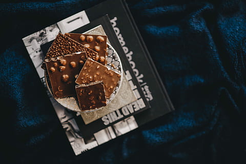 close, nut chocolate bar, Close up, nut, chocolate bar, sweet, candy, chocolate, dark, close-up, food, no people, high angle view, indoors, black background, day, food and drink, text, brown, sweet food, freshness, table, communication, still life, shape, indulgence, selective focus, baked, textile, temptation, snack, 5K, CC0, public domain, royalty free