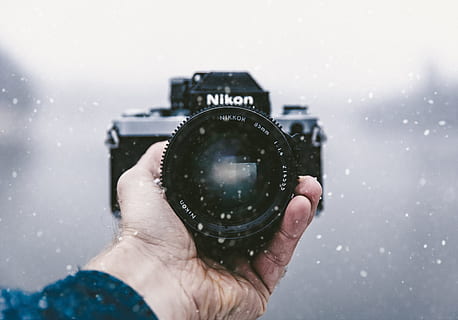 person, holding, nikon dslr camera, black, Nikon, Snow, camera, snowfall, hand, hold, camera - Photographic Equipment, photographer, people, one Person, photography Themes, men, adult, human Hand, photographing, outdoors, equipment, human body part, one man only, activity, technology, lens - optical instrument, snowing, close-up, lens - eye, photographic equipment, winter, mature men, digital camera, 5K, CC0, public domain, royalty free
