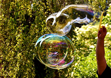 Soap Bubbles, Huge, large, make soap bubbles, wabbelig, iridescent, soapy water, fun, fly, colorful, bubble, soap Sud, bubble Wand, outdoors, blowing, nature, people, summer, playful, playing, green Color, joy, enjoyment, one Person, happiness, holding, day, fragility, transparent, sphere, vulnerability, reflection, focus on foreground, plant, tree, sunlight, real people, mid-air, shiny, leisure activity, close-up, 4K, CC0, public domain, royalty free