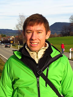 man, human, portrait, face, wanderer, tourist, walkers, out, cold, jacket, winter jacket, outdoors, people, men, one Person, caucasian Ethnicity, smiling, looking at camera, real people, adult, mid adult, leisure activity, green color, clothing, front view, happiness, day, emotion, young adult, mid adult men, headshot, nature, warm clothing, 4K, CC0, public domain, royalty free