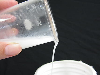 liquid, beaker, white, human hand, hand, human body part, pouring, drink, holding, refreshment, one person, close-up, food and drink, finger, human finger, motion, body part, unrecognizable person, black background, indoors, milk, glass, drinking, 4K, CC0, public domain, royalty free