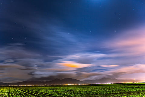 green, field, twilight painting, grass, cloudy, blue, sky, clouds, farm, lights, mountain, landscape, nature, horizon, stars, agriculture, rural scene, crop, cloud - sky, no people, scenics, environment, scenics - nature, beauty in nature, night, tranquility, land, outdoors, dramatic sky, tranquil scene, star - space, plant, 4K, CC0, public domain, royalty free