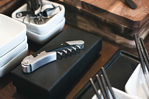 Wine opener, kitchenware, equipment, no People, work tool, indoors, repairing, hand tool, close-up, tool, still life, table, high angle view, metal, focus on foreground, black color, communication, selective focus, choice, group of objects, silver colored, reflection, kitchen utensil, 5K, CC0, public domain, royalty free