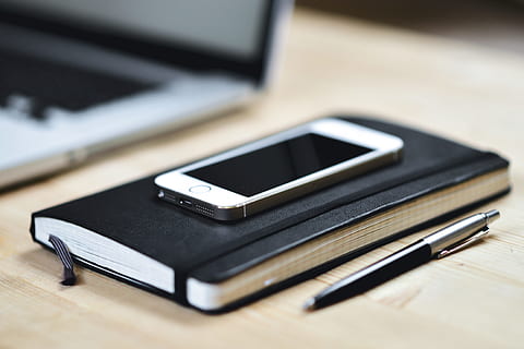 iphone smartphone, notebook, iPhone, smartphone, technology, business, communication, computer, laptop, marketing, office, phone, tech, equipment, desk, table, no People, pen, mobile Phone, close-up, telephone, wireless Technology, smart Phone, mobility, pC, connection, portable information device, still life, indoors, portability, selective focus, screen, device screen, telecommunications equipment, black color, keyboard, 4K