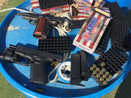 ammo, ammo subscription, bullets, ammo drop, shooter, 223, 9mm, handgun, ammunition, pistol, gun, firearm, armed, arm, weapon, 45acp, 45 caliber, no people, technology, day, high angle view, communication, still life, arts culture and entertainment, close-up, collection, outdoors, sunlight, violence, metal, equipment, nature, military, aggression, 2K, CC0, public domain, royalty free