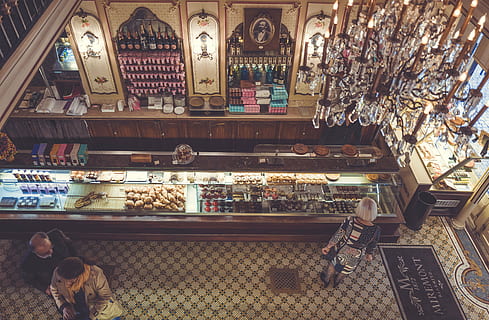 architecture, bird's eye view, building, chandelier, food, indoors, pastries, people, sale, retail, choice, for sale, variation, large group of objects, store, food and drink, abundance, retail display, arrangement, shopping, collection, no people, small business, business, container, order, display cabinet, consumerism, 4K