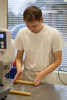 baker, dough, work, indoors, real people, one person, standing, front view, child, men, holding, boys, occupation, kitchen, males, casual clothing, preparation, preparing food, domestic room, food, food and drink, innocence, 5K, CC0, public domain, royalty free