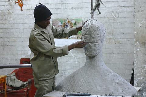 man sculpting head statue, man, head, statue, people, indoors, occupation, studio, adult, adults only, one person, art and craft, sculpture, craft, creativity, skill, sculptor, working, side view, artist, men, three quarter length, standing, holding, 4K, CC0, public domain, royalty free