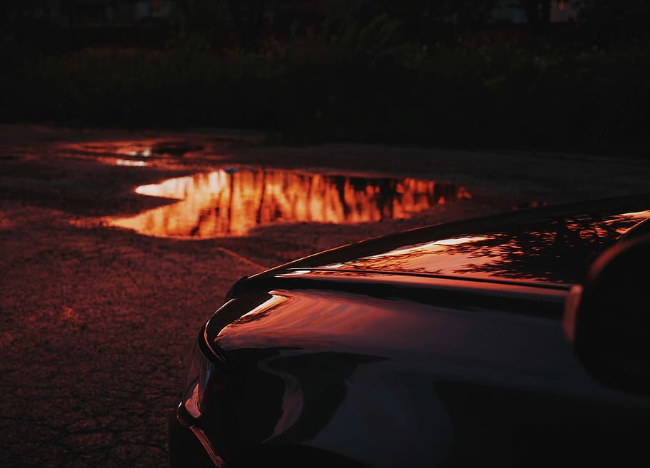 car, front, mud, car hood, puddle, reflection, ground, dusk, transportation, mode of transportation, motor vehicle, nature, land vehicle, no people, close-up, focus on foreground, water, sunset, outdoors, travel, lake, night, red, dark, 4K