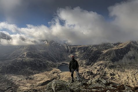 person, standing, rocky, mountain, daytime, man, overlooking, lake, cloud, hike, top, peak, canyon, adventure, one person, cloud - sky, sky, leisure activity, scenics - nature, activity, hiking, beauty in nature, nature, landscape, tranquility, tranquil scene, full length, non-urban scene, men, mountain range, outdoors, 5K, CC0, public domain, royalty free