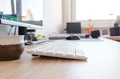 cup, desk, office, internet, background, business, communication, computer, creativity, digital, display, furniture, indoors, information, keyboard, monitor, mouse, pc, room, table, technology, white, window, wooden, workplace, connection, computer equipment, wireless technology, desktop pc, laptop, focus on foreground, day, no people, computer keyboard, place of work, home office, modern, 5K, CC0, public domain, royalty free