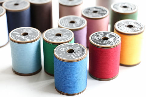 thread, creativity, sewing, handmade, needlework, hobby, choice, spool, variation, multi colored, group of objects, industry, indoors, in a row, no people, studio shot, textile, sewing item, still life, medium group of objects, art and craft, group, blue, textile industry, purple, 5K, CC0, public domain, royalty free