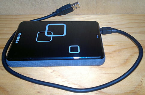 black, toshiba, external, drive, external hard drive, usb, storage, memory, memories, external hard disk drive, toshiba 1 tb external usb, flash, technology, computer, connection, data transfer, training, equipment, portable, accessory, digital, electronics, connector, usb plug, cable, cord, specifications, wire, connect, head, load, charger, adapter, network, jack, charging cable, communication, indoors, still life, no people, electricity, close-up, differing abilities, medical equipment, network connection plug, wood - material, table, high angle view, wireless technology, text, fuel and power generation, power supply, internet, 2K, CC0, public domain, royalty free