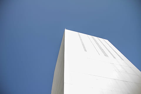 white concrete building, low, angle, photography, white, high, rise, building, architecture, blue, sky, clear sky, low angle view, day, sunlight, no people, outdoors, close-up, sailing ship, copy space, built structure, white color, nature, building exterior, sunny, modern, tall - high, travel destinations, wall - building feature, 2K, CC0, public domain, royalty free