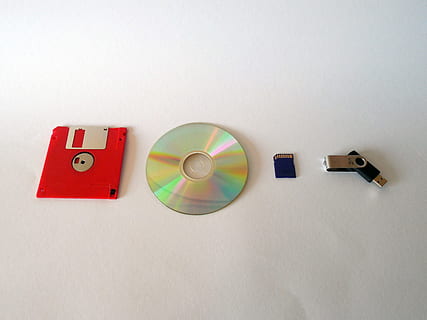 floppy, disc, compact, disk, stick, flash drive, Memory, Data, Floppy Disk, Cd, Dvd, Usb, storage medium, memory chip, memory card, single Object, plastic, indoors, no people, white background, day, close-up, multi colored, copy space, wall - building feature, still life, geometric shape, circle, white color, shape, art and craft, red, home interior, paper, table, choice, high angle view, 2K, CC0, public domain, royalty free