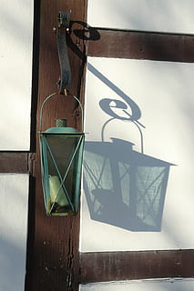 truss, hispanic, lamp, no people, wall - building feature, shadow, architecture, day, built structure, hanging, wood - material, outdoors, nature, sunlight, close-up, wall, sign, window, glass - material, communication, symbol, 2K, CC0, public domain, royalty free