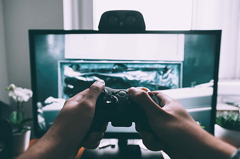 person, holding, game controller in-front, television, game controller, playing, front, turned, flat, screen tv, inside, entertainment room, computer, technology, hand, game, entertainment, play, gameplay, controller, console, electronic, screen, tv, video game, video, human hand, real people, human body part, indoors, personal perspective, people, adult, lifestyles, focus on foreground, photography themes, men, leisure activity, communication, close-up, women, business, 4K, CC0, public domain, royalty free