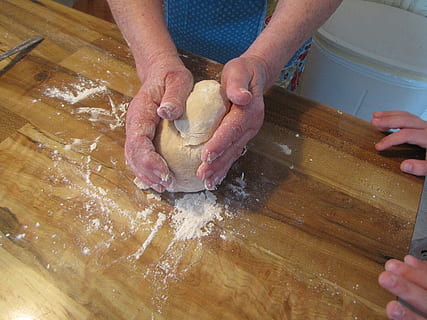 person making dough, dough, biscuit, chef, cook, grandmother, child, food and drink, preparation, food, flour, human body part, human hand, indoors, hand, preparing food, adult, pasta, one person, freshness, kneading, occupation, making, skill, kitchen, 720P, CC0, public domain, royalty free