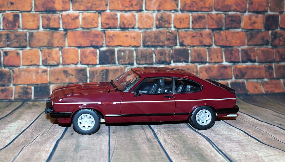 modello di auto, guado, capri, modello, auto, vecchi tempi, giocattoli, auto sportiva, vecchio, rosso, motorsport, veicolo, classico, muro di mattoni, mattone, vecchio stile, in stile retrò, auto da collezione, all'aperto, giorno, nessuno, veicolo a motore, modo di trasporto, parete, mezzi di trasporto, giocattolo, macchina giocattolo, caratteristica della parete, infanzia, architettura, veicolo terrestre, macchina vintage, una persona, 4K