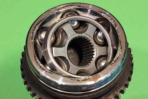 constant, velocity, joint, coupling, automotive, car, drivetrain, housing, cv, assembled, race, cage, ball, driveshaft, homokinetic, metal, close-up, no people, shape, circle, geometric shape, pattern, design, indoors, studio shot, directly above, shiny, open, single object, cut out, extreme close-up, can, silver colored, black color, gear, wheel, 5K, CC0, public domain, royalty free